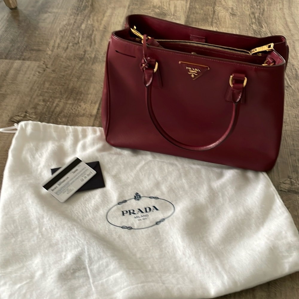 Prada Cerise bag with shoulder strap.  12"x9 1/2"x 4 1/2"